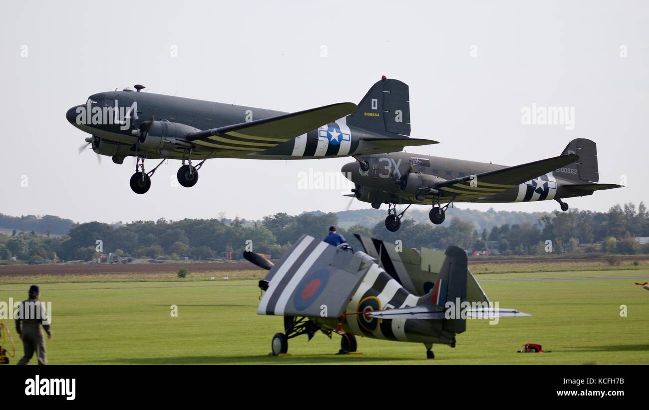 Two Douglas C-47 Skytrain aircraft in formation at Duxford Aerodrome Stock Photo