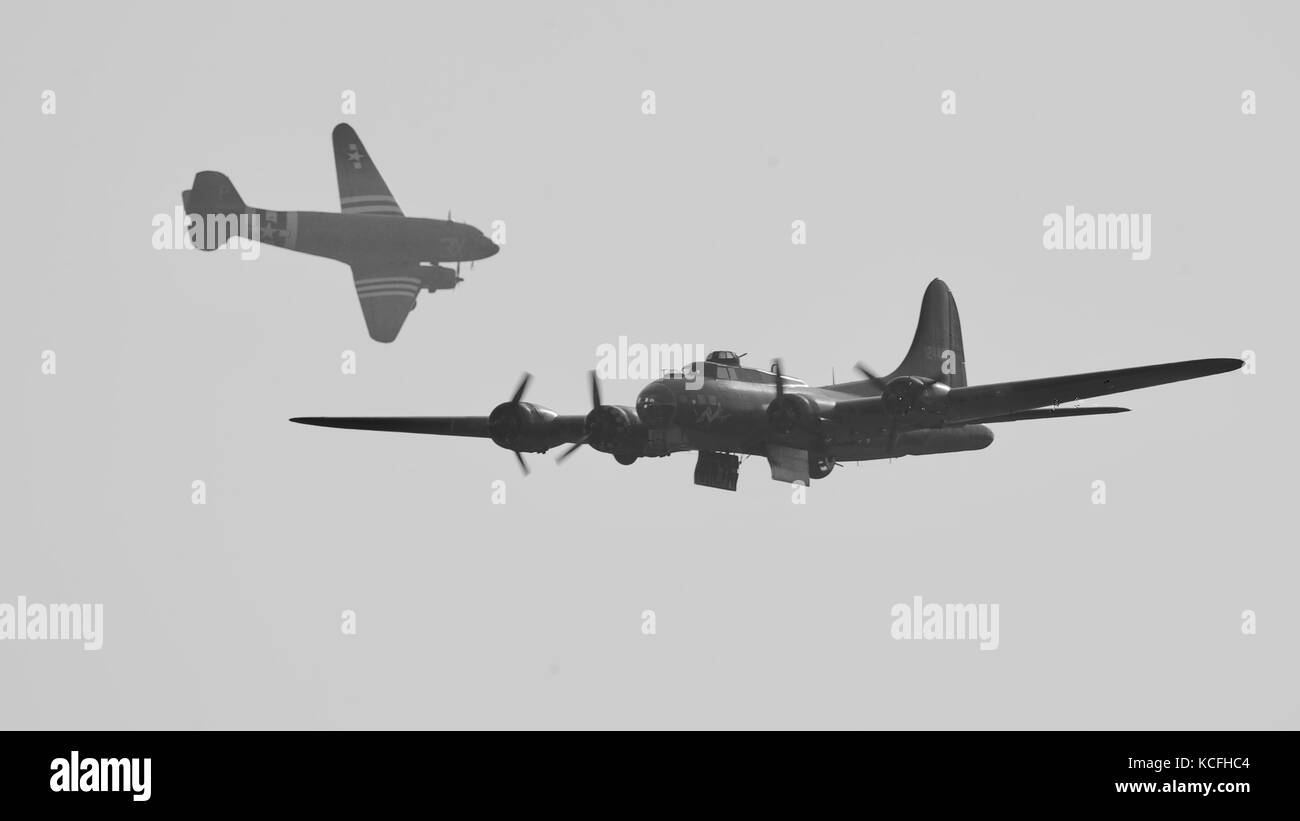 Boeing B-17 Flying Fortress 'Sally b' with a Douglas C-47 Skytrain 'Drag-em-oot' in the background Stock Photo