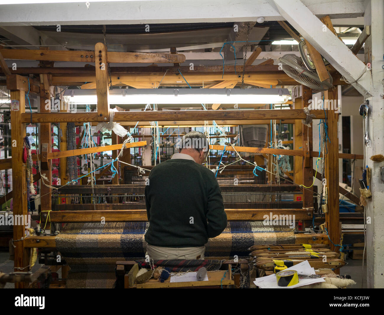 A Man demonstrates weaving at Avoca Handweavers, Wicklow, Ireland Stock