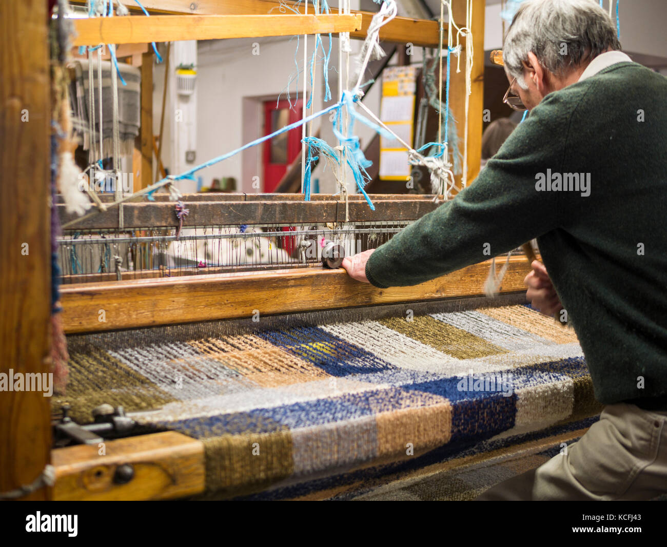 A Man demonstrates weaving at Avoca Handweavers, Wicklow, Ireland Stock