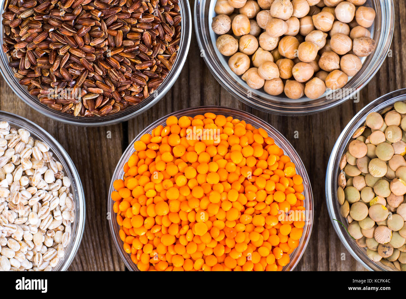 Vegan meal. Healthy organic cereals on wooden background Stock Photo