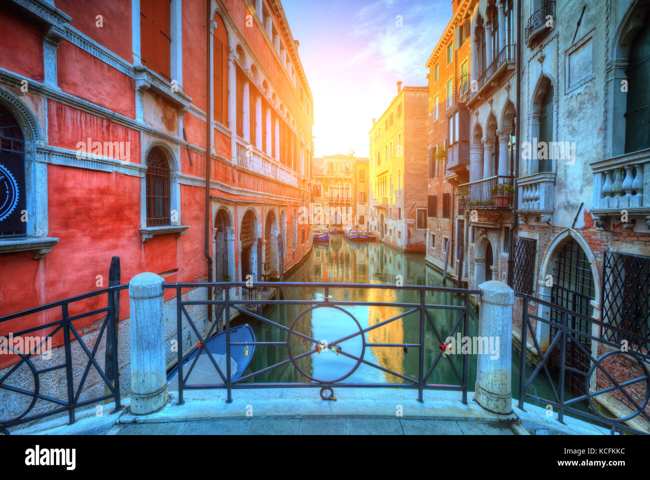 Historical streets in water canal filled with green water. Famous old town Venice, Italy. Stock Photo