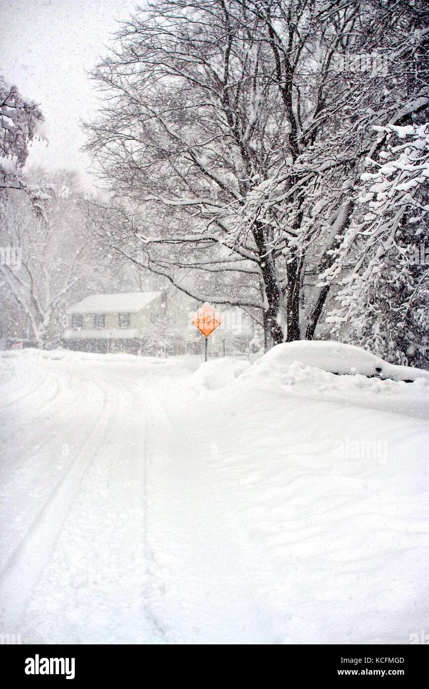 Deep snow blankets a suburban Philadelphia neighborhood following a blizzard. Stock Photo