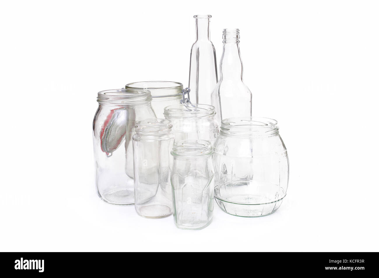 Clear glass jars and bottles over white Stock Photo Alamy