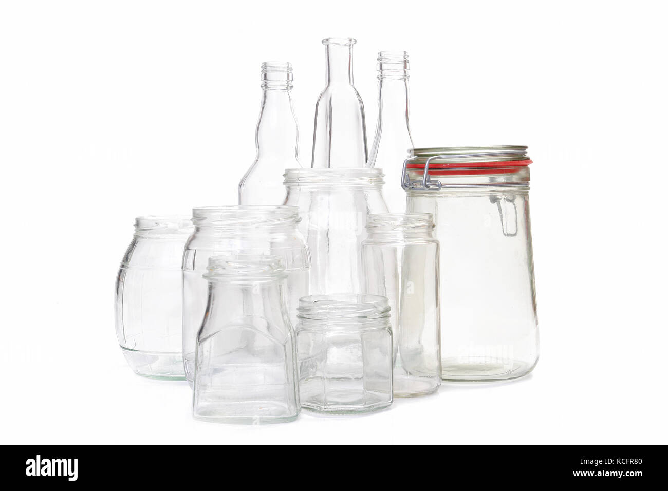 Clear glass jars and bottles over white background Stock Photo Alamy