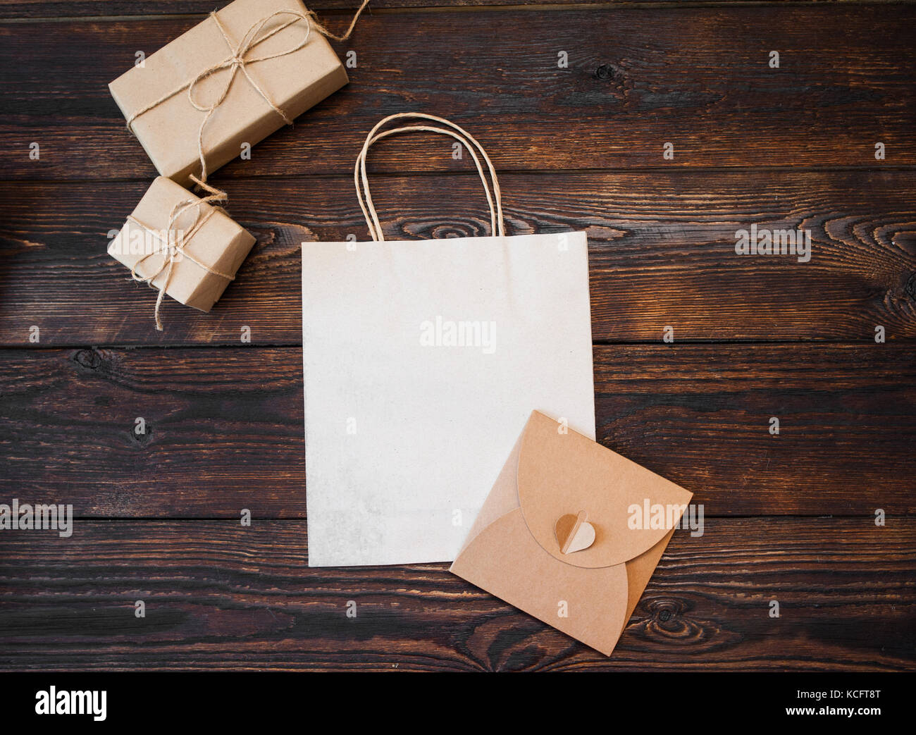 Download Mockup Kraft Gift Boxes With Package On Wooden Background Stock Photo Alamy