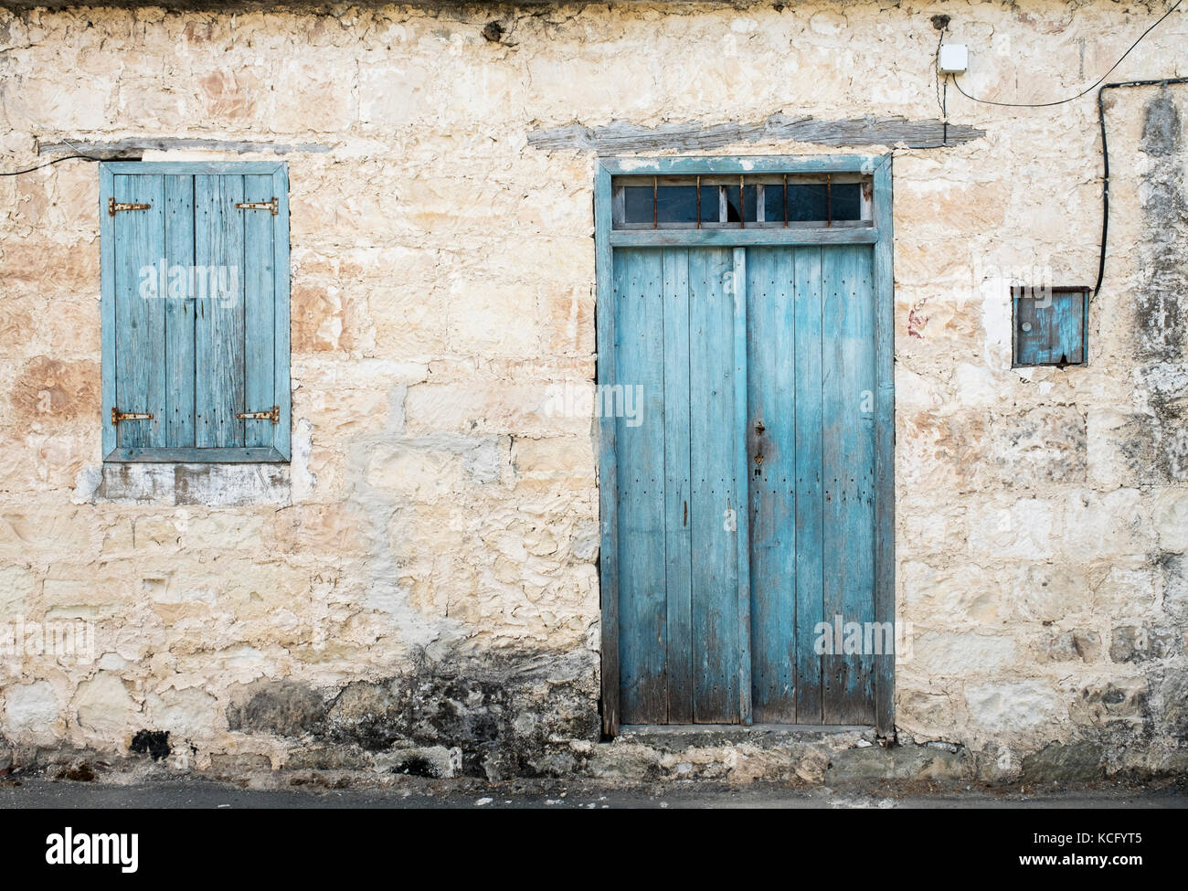 Faded door and window shutters in the Cypriot village of Agios Dimitrianos, in the Paphos region of Southern Cyprus. Stock Photo