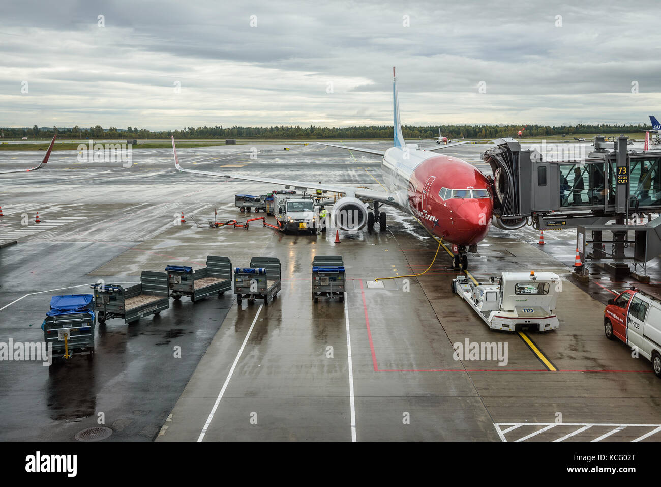 Norwegian plane being boarded at the Oslo Gardermoen airport Stock Photo