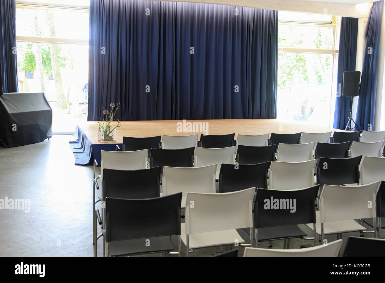 Stage with chairs and curtain Stock Photo - Alamy