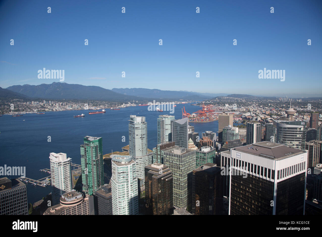 North America, Canada, British Columbia, Vancouver, high angle view of Port area of Vancouver. City skyline, waterfront and harbour area in distance Stock Photo