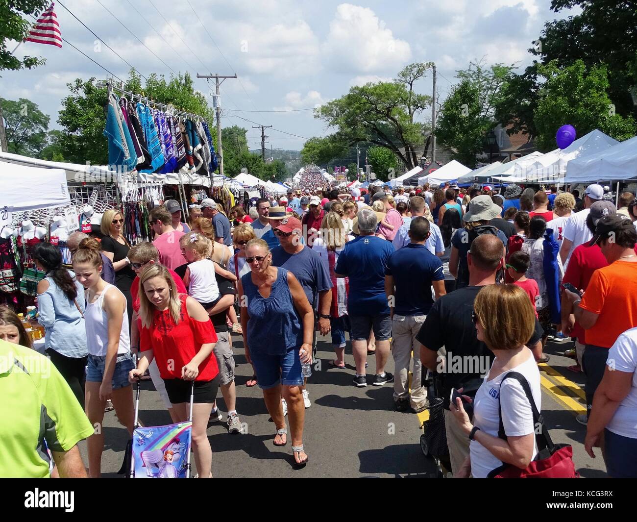 Hoards of people attending market stalls at a 4th of July Festival Stock Photo