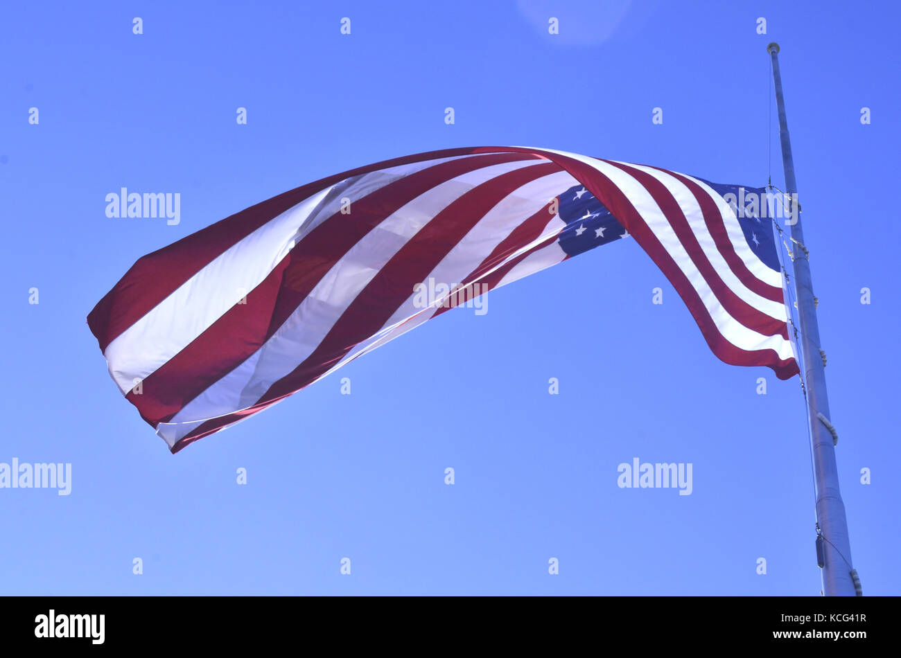 American flag flying at halfstaff Stock Photo Alamy