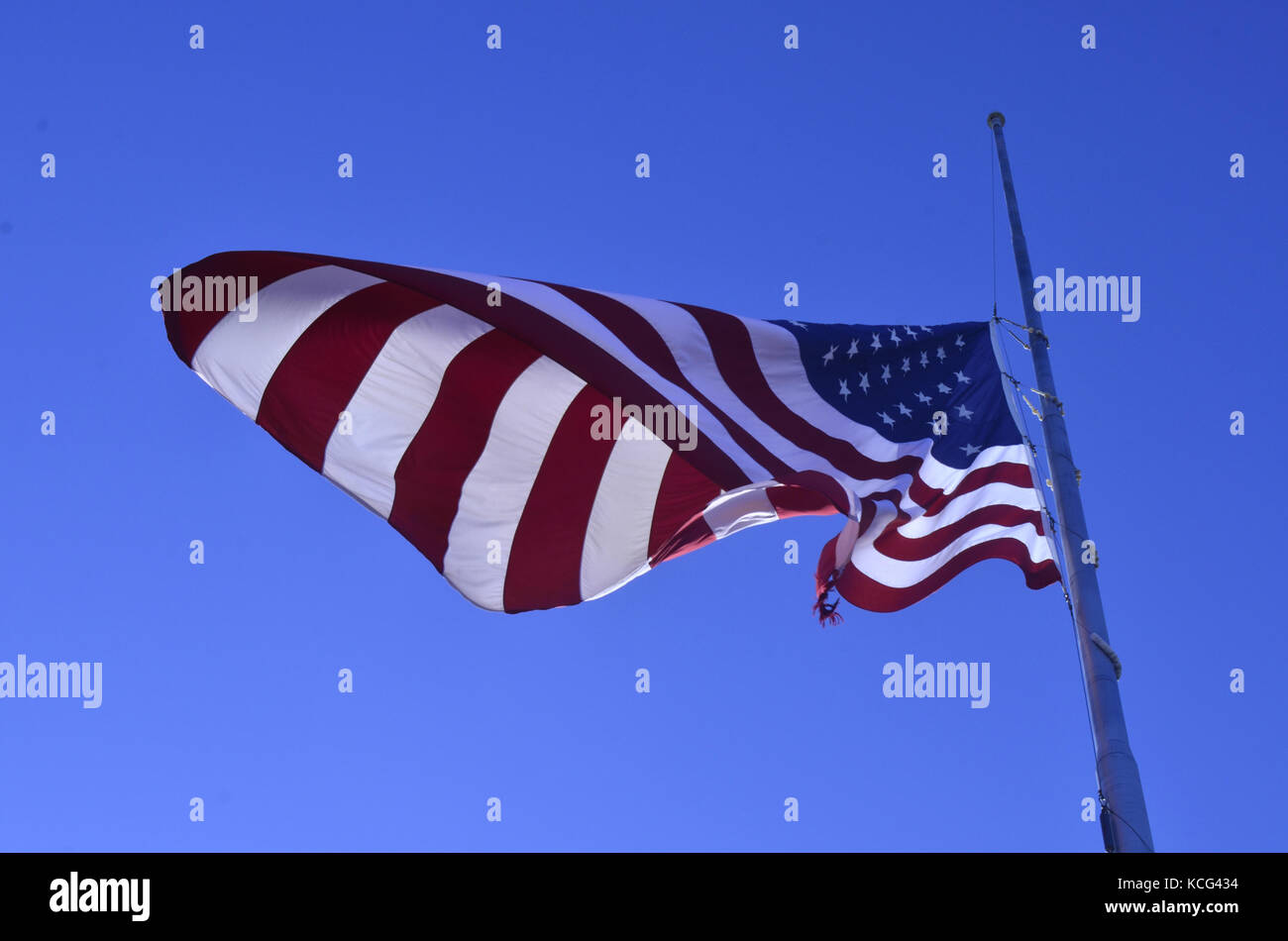 American flag flying at halfstaff Stock Photo Alamy