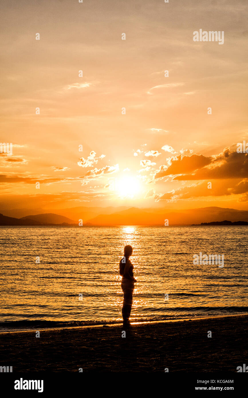 Silhouette Of Woman Watching The Sunset High Resolution Stock ...