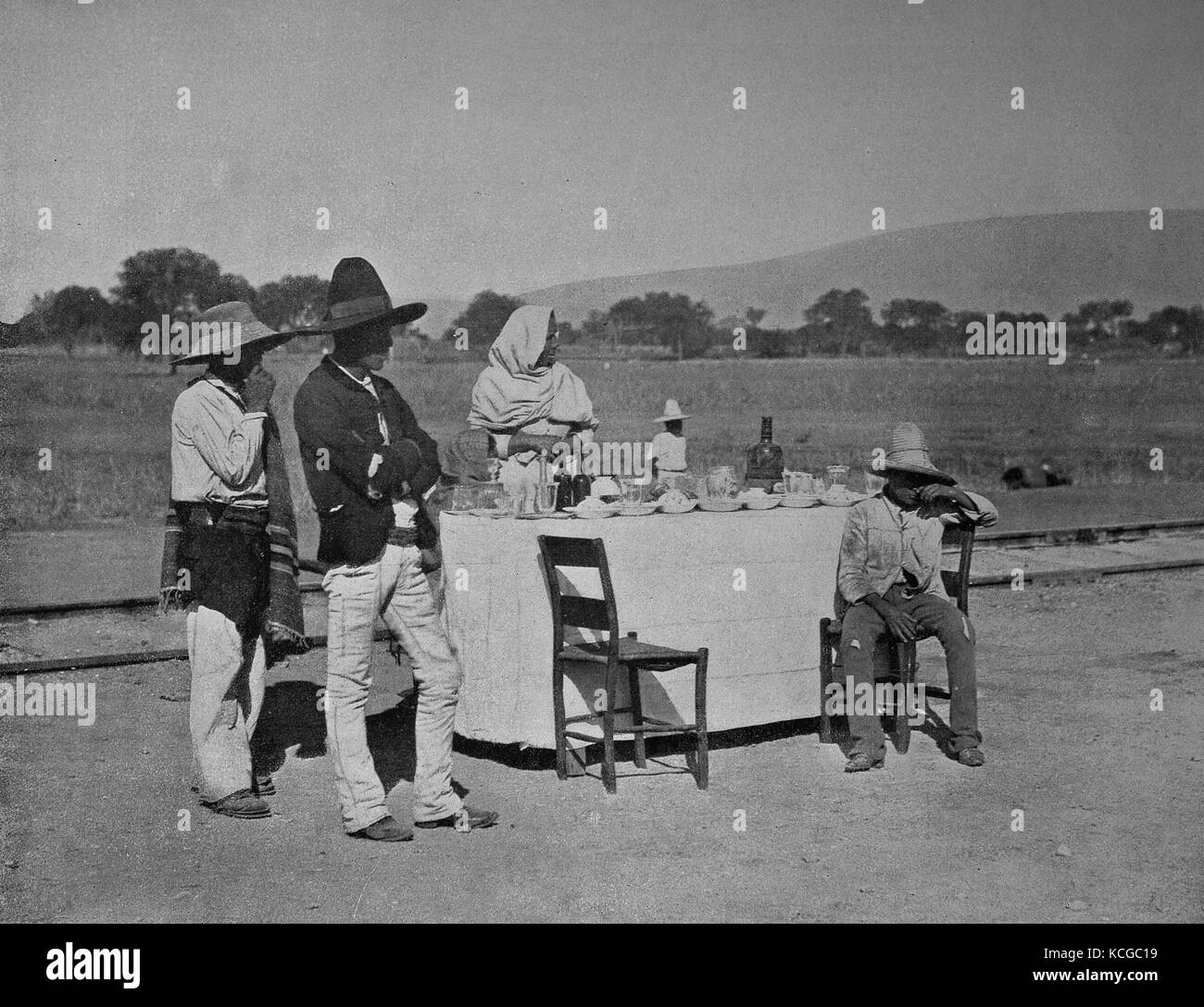Mexico, coffee at the Mexican Central Railroad, woman in Mexican costume offers the traveler country-style drinks and cakes, digital improved reproduction of a historical photo from the (estimated) year 1899 Stock Photo