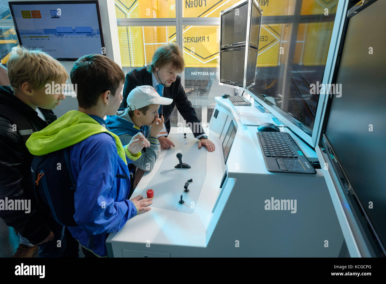Children study the train driving simulator Stock Photo Alamy