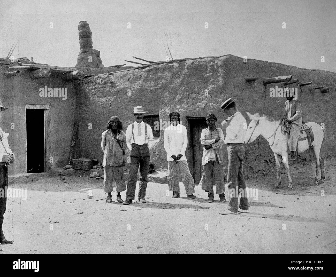 United States of America, descendants of the ancient Aztecs and descendants of the Spanish conquerors in front of an adobe house in New Mexico, digital improved reproduction of a historical photo from the (estimated) year 1899 Stock Photo