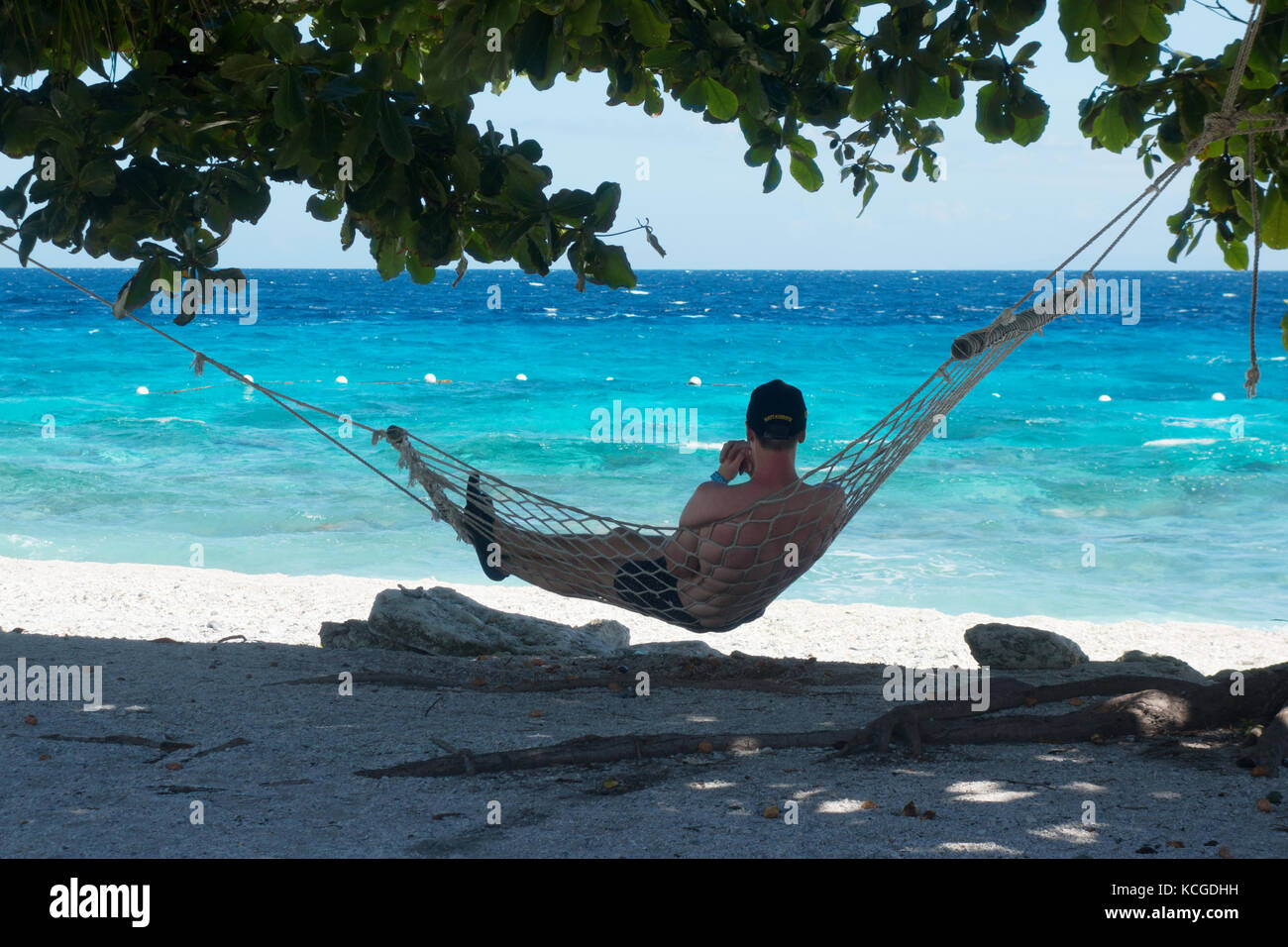 Philippines beach, Cebu island - a tourist relaxing in a hammock on holiday, Cebu, Philippines, Asia Stock Photo