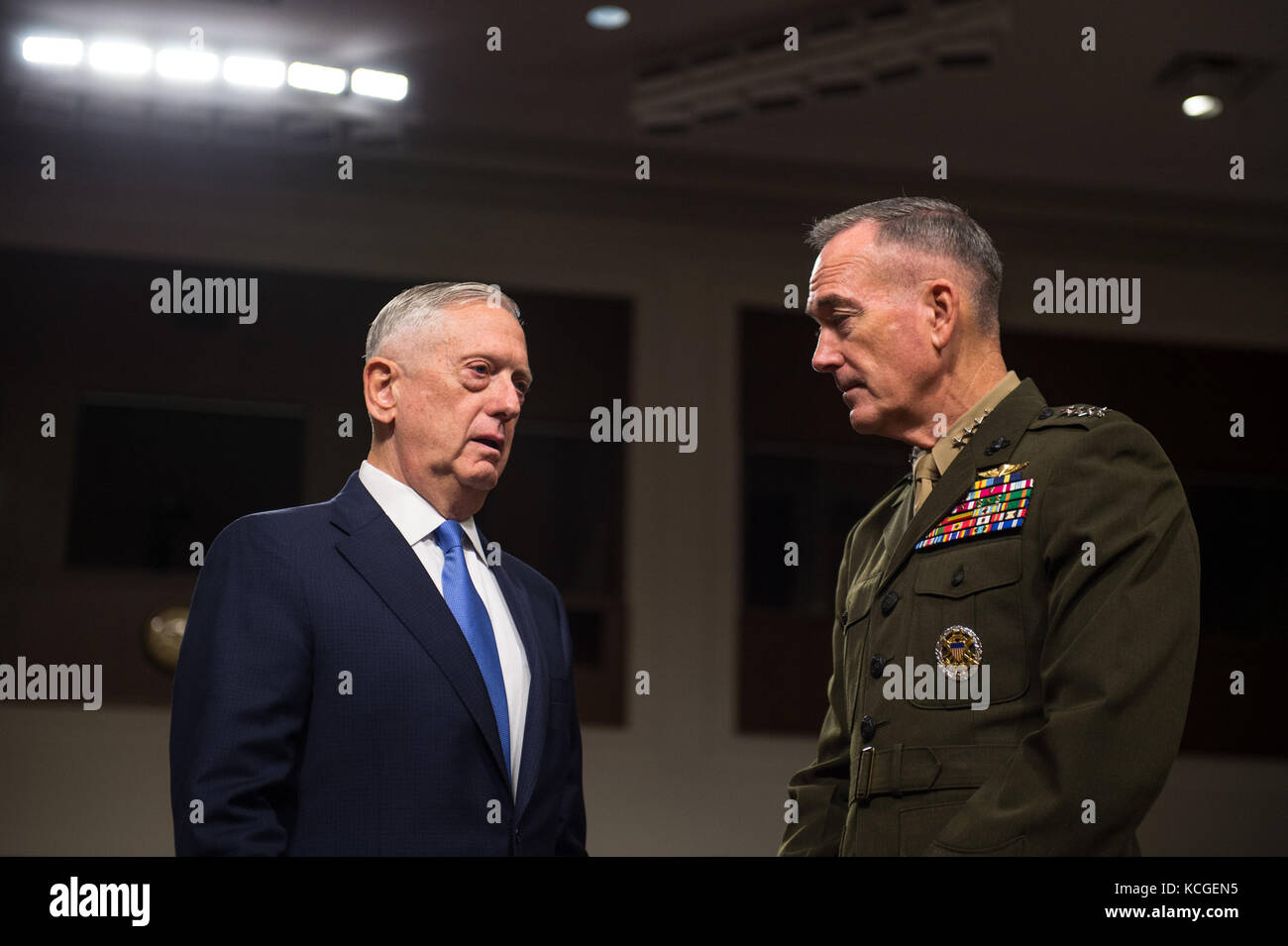 Secretary of Defense Jim Mattis speaks with U.S. Marine Corps Gen. Joseph F. Dunford, Jr., chairman of the Joint Chiefs of Staff Stock Photo