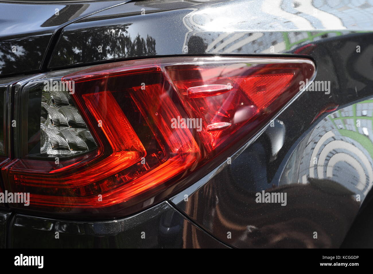 Rear indicator light of a black Lexus car in daylight Stock Photo Alamy