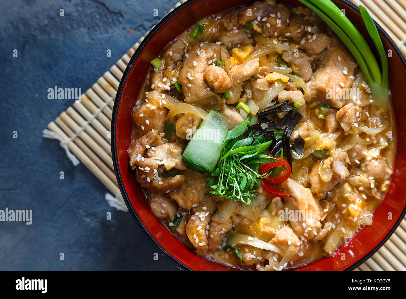 Oyakodon Japanese rice on topped with chicken, egg, onion, and seaweed