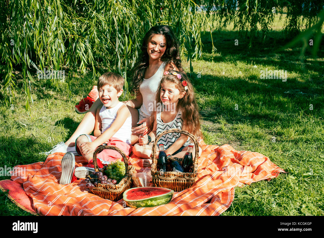 cute happy family on picnic laying on green grass mother and kid Stock ...