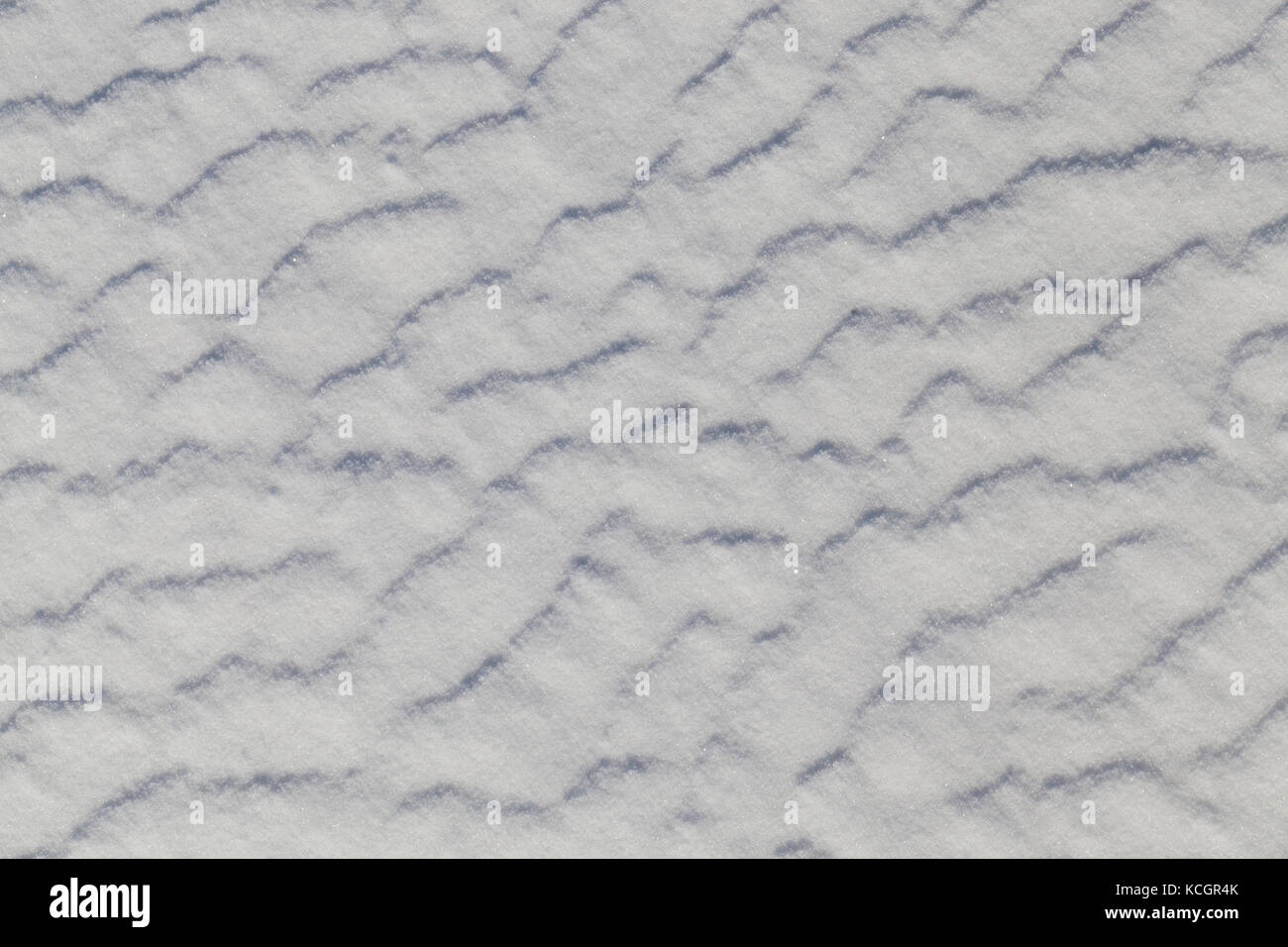 snow drifts after the past snowfall. On the surface irregularities from ...