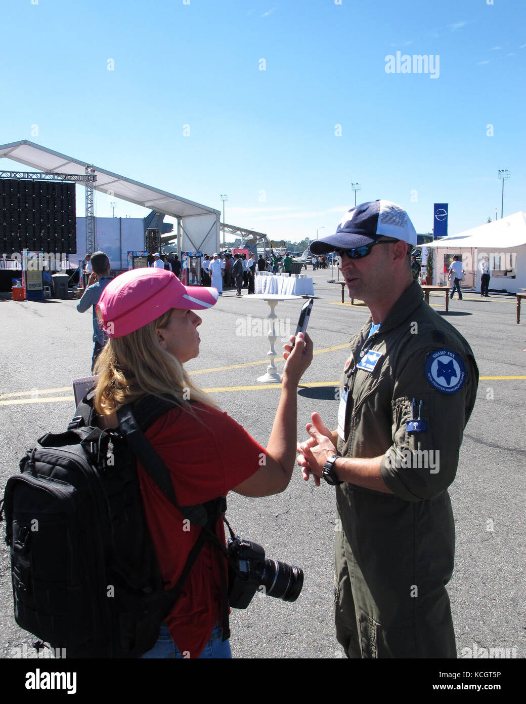 Geraldine Cook (left), journalist with U.S. Southern Command’s Dialogo Digital Military Magazine, interviews U.S. Air Force Lt. Col. Jeff Beckham, an F-16 pilot with the South Carolina Air National Guard’s 169th Fighter Wing before the start of Colombian Air Force’s Feria Aeronautica Internaccional – Colombia in Rionegro, Colombia, July 13, 2017. The United States Air Force is participating in the four-day air show with two South Carolina Air National Guard F-16s as static displays, plus static displays of a KC-135, KC-10, along with an aerial demonstration by the Air Combat Command’s Viper Ea Stock Photo
