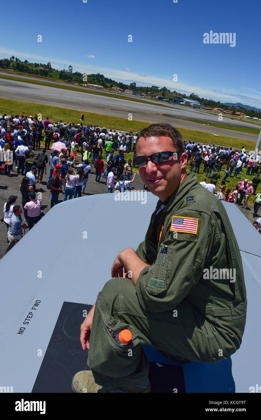 U.S. Air Force Capt. Dan Shaheen, a pilot assigned to the 507th Aerial Refueling Wing at Tinker Air Force Base, poses for a picture during Feria Aeronautica Internacional—Colombia 2017 at José María Córdova International Airport in Rionegro, Colombia, July 13, 2017. The United States Air Force is participating in the four-day air show with two South Carolina Air National Guard F-16s as static displays, plus static displays of a KC-135, KC-10, along with an F-16 aerial demonstration by the Air Combat Command’s Viper East Demo Team. United States military participation in the air show provides a Stock Photo