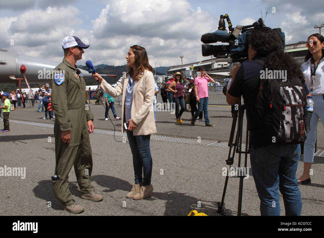 U.S. Air Force Lt. Col. Jeff Beckham, an F-16 pilot with the South Carolina Air National Guard’s 169th Fighter Wing, speaks to Juanita Gomes, a reporter from Noticias Caracol television from Bogota, Colombia during the Colombian Air Force’s Feria Aeronautica Internaccional – Colombia in Rionegro,  July 14, 2017. The United States Air Force is participating in the four-day air show with two South Carolina Air National Guard F-16s as static displays, plus static displays of a KC-135, KC-10, along with an aerial demonstration by the Air Combat Command’s Viper East Demo Team and a B-52 flyover. Th Stock Photo