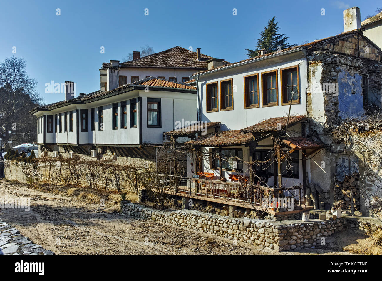 Old Houses near the river and main Street in Melnik town, Blagoevgrad region, Bulgaria Stock Photo