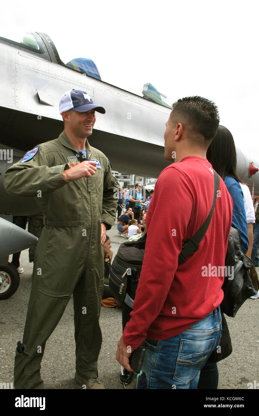 U.S. Air Force Lt. Col. Jeff Beckham, an F-16 pilot with the South Carolina Air National Guard’s 169th Fighter Wing, speaks visitors during the Colombian Air Force’s Feria Aeronautica Internaccional – Colombia in Rionegro, July 15, 2017. The United States Air Force is participating in the four-day air show with two South Carolina Air National Guard F-16s as static displays, plus static displays of a KC-135, KC-10, along with an F-16 aerial demonstration by the Air Combat Command’s Viper East Demo Team. The United States military participation in the air show provides an opportunity to strength Stock Photo