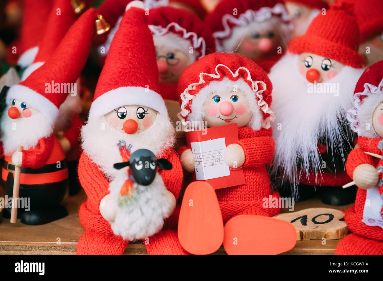 Traditional Souvenirs Santa Claus Dolls Toys At European Winter Christmas Market. New Year Wooden Souvenir From Europe. Stock Photo