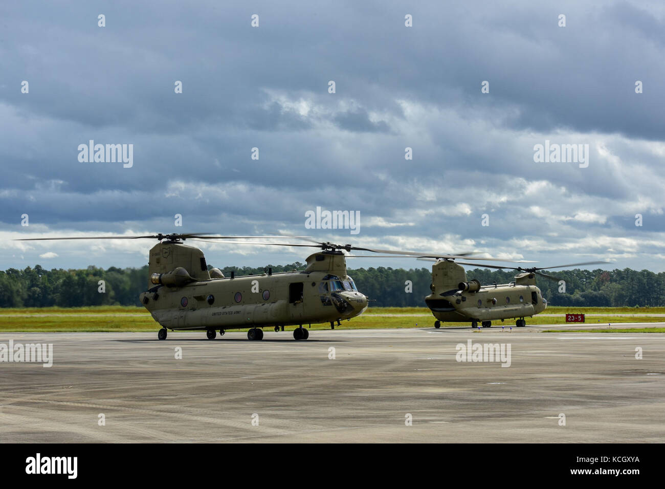 Two Boeing CH-47F Chinook aircraft assigned to the Ohio National Guard’s 3-238th General Aviation Support Battalion take off from McEntire Joint National Guard Base, S.C., on their way to Naval Air Station Cecil Field in Jacksonville, Florida as part of a response to Hurricane Irma, Sept. 12, 2017.  McEntire JNGB served as a transition point for the unit to refuel before heading on to Florida. Both aircraft recently responded to the damage and flooding in Texas caused by Hurricane Harvey by moving supplies and personnel. Hurricane Irma peaked as a Category 5 hurricane in the Atlantic Ocean and Stock Photo