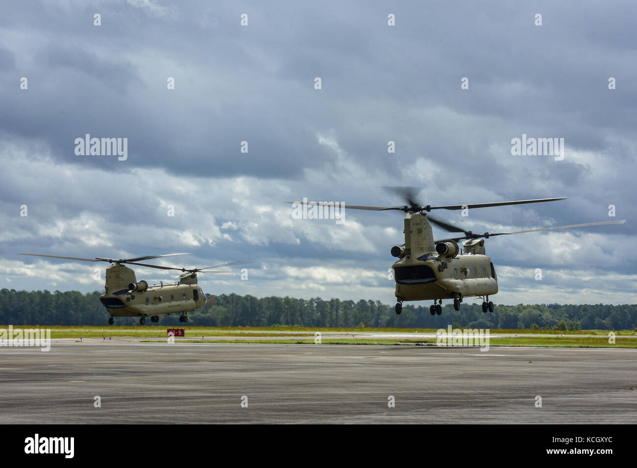 Two Boeing CH-47F Chinook aircraft assigned to the Ohio National Guard’s 3-238th General Aviation Support Battalion take off from McEntire Joint National Guard Base, S.C., on their way to Naval Air Station Cecil Field in Jacksonville, Florida as part of a response to Hurricane Irma, Sept. 12, 2017.  McEntire JNGB served as a transition point for the unit to refuel before heading on to Florida. Both aircraft recently responded to the damage and flooding in Texas caused by Hurricane Harvey by moving supplies and personnel. Hurricane Irma peaked as a Category 5 hurricane in the Atlantic Ocean and Stock Photo