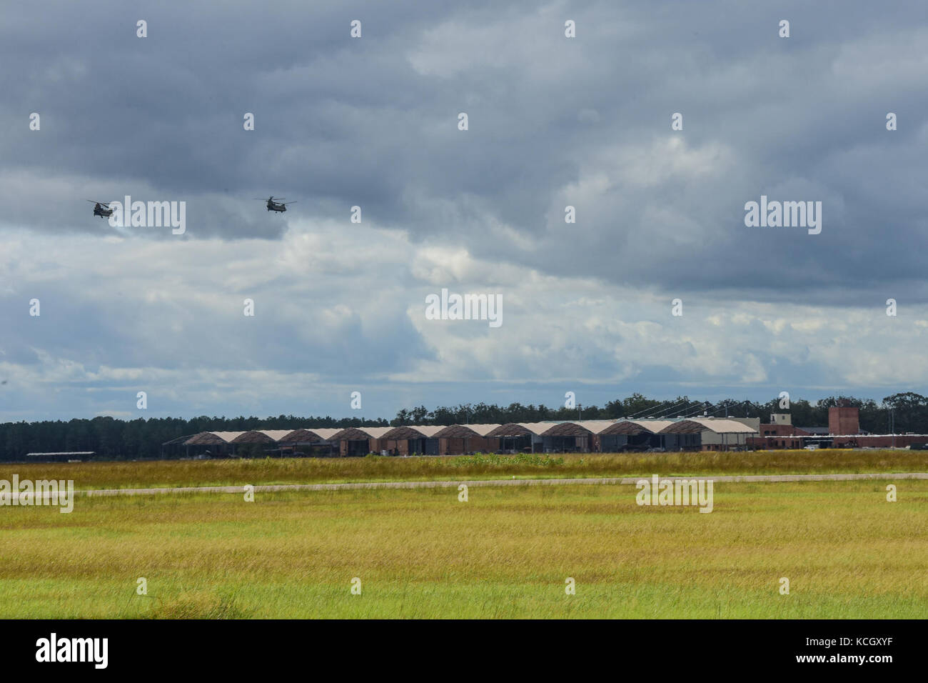 Two Boeing CH-47F Chinook aircraft assigned to the Ohio National Guard’s 3-238th General Aviation Support Battalion take off from McEntire Joint National Guard Base, S.C., on their way to Naval Air Station Cecil Field in Jacksonville, Florida as part of a response to Hurricane Irma, Sept. 12, 2017.  McEntire JNGB served as a transition point for the unit to refuel before heading on to Florida. Both aircraft recently responded to the damage and flooding in Texas caused by Hurricane Harvey by moving supplies and personnel. Hurricane Irma peaked as a Category 5 hurricane in the Atlantic Ocean and Stock Photo