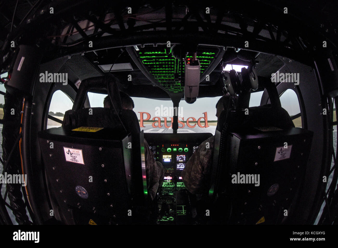 U.S. Army helicopter pilots Cpt. Chris Jones and Chief Warrant Officer Daniel Melogy, HHC 2-151st Security and Support Aviation Battalion (2-151st SSAB), S.C. Army National Guard, perform the first, official (logged training hours), training on the newly acquired LUH-72A Lakota Synthetic Flight Training System (SFTS), Army Aviation Support Facility (loc. 2), Donaldson Center, Greenville, South Carolina, September 12, 2017. Each LUH-72A SFTS is comprised of a tractor-trailer containing the LUH-72A flight training device (FTD) with a two-seat cockpit, six Virtual Reality Scene Generators (VRSG l Stock Photo