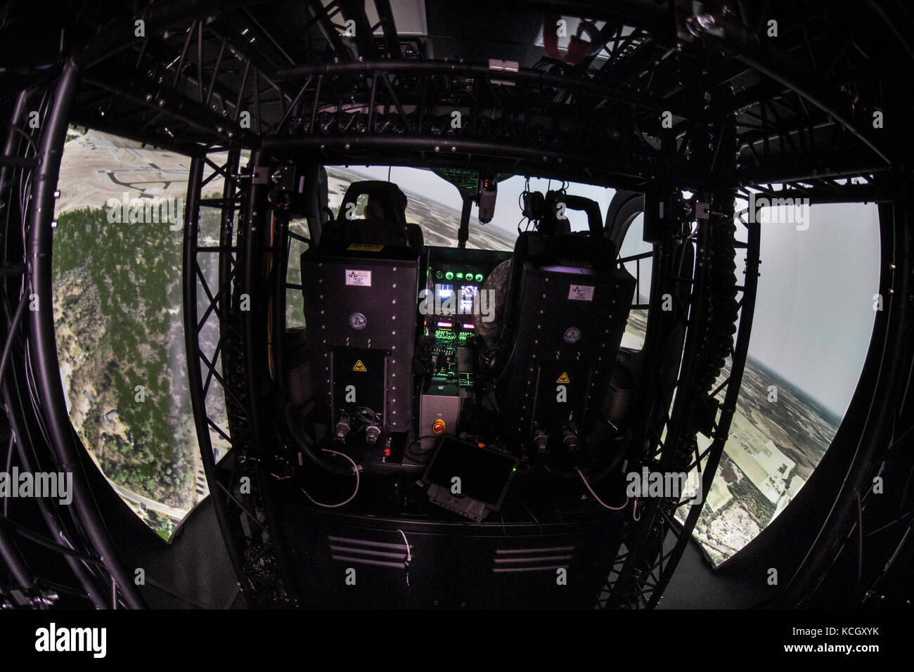 U.S. Army helicopter pilots Cpt. Chris Jones and Chief Warrant Officer Daniel Melogy, HHC 2-151st Security and Support Aviation Battalion (2-151st SSAB), S.C. Army National Guard, perform the first, official (logged training hours), training on the newly acquired LUH-72A Lakota Synthetic Flight Training System (SFTS), Army Aviation Support Facility (loc. 2), Donaldson Center, Greenville, South Carolina, September 12, 2017. Each LUH-72A SFTS is comprised of a tractor-trailer containing the LUH-72A flight training device (FTD) with a two-seat cockpit, six Virtual Reality Scene Generators (VRSG l Stock Photo