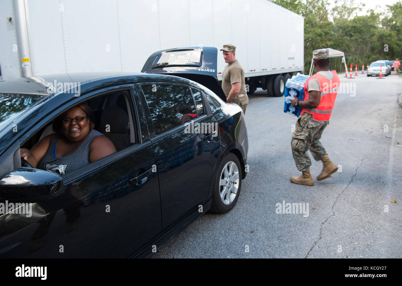 U.S. Soldiers from C Company, 1-118th Infantry, 218th Maneuver Enhancement Brigade, South Carolina Army National Guard distributed food and water in Hillsborough County, FL Sept. 15, 2017. The Soldiers are in Florida providing support during the recovery efforts after Hurricane Irma came ashore and devastated the state.  (U.S. Army National Guard Photo by Staff Sgt. Erica Knight, 108th Public Affairs Detachment) Stock Photo