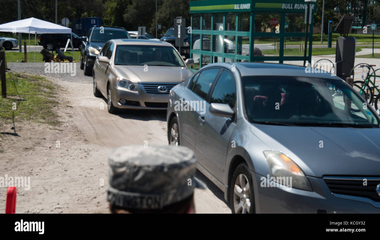U.S. Soldiers from C Company, 1-118th Infantry, 218th Maneuver Enhancement Brigade, South Carolina Army National Guard distributed food and water in Hillsborough County, FL Sept. 16, 2017. The Soldiers are in Florida providing support during the recovery efforts after Hurricane Irma came ashore and devastated the state.  (U.S. Army National Guard Photo by Staff Sgt. Erica Knight, 108th Public Affairs Detachment) Stock Photo