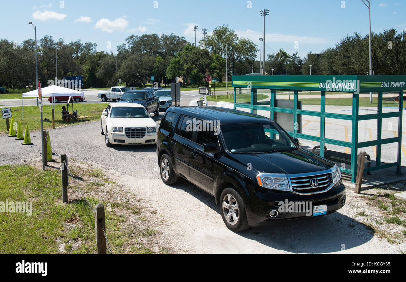 U.S. Soldiers from C Company, 1-118th Infantry, 218th Maneuver Enhancement Brigade, South Carolina Army National Guard distributed food and water in Hillsborough County, FL Sept. 16, 2017. The Soldiers are in Florida providing support during the recovery efforts after Hurricane Irma came ashore and devastated the state.  (U.S. Army National Guard Photo by Staff Sgt. Erica Knight, 108th Public Affairs Detachment) Stock Photo