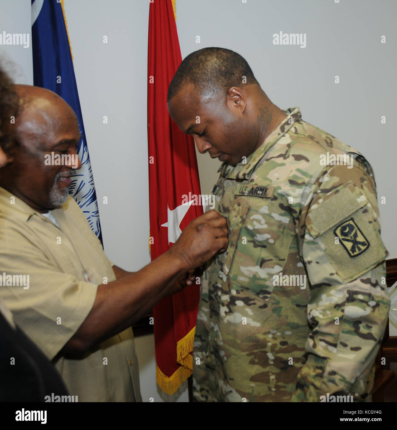 Two South Carolina Army National Guard Soldiers are commissioned as second lieutenants joining three more South Carolina Army National Guard officers in being recognized as the newest members of the Chaplain Corps. at the Adjutant General’s building in Columbia, South Carolina on September 22, 2017. (U.S. Army National Guard photo by 1st Lt. Cody I. Denson) Stock Photo