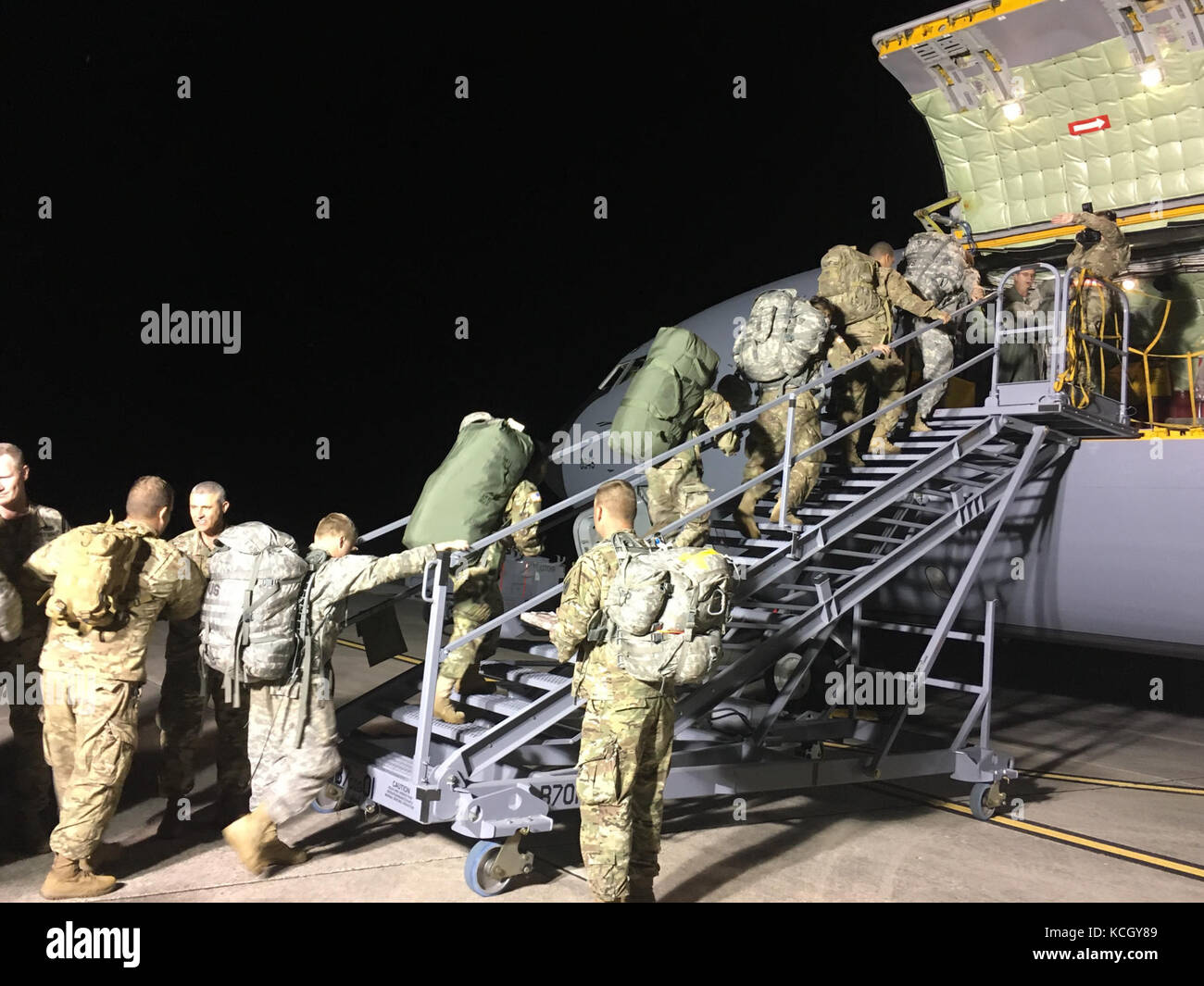 U.S. National Guard Soldiers from the South Carolina National Guard's 122nd and 178th Engineer Battalions depart McEntire Joint National Guard Base in Eastover, South Carolina aboard a KC-135 Stratotanker from the 127th Air Refueling Group, Selfridge Air National Guard Base, Michigan to provide Hurricane Maria relief support to Puerto Rico, Oct. 1, 2017. Over the next 24 hours, approximately 150 South Carolina National Guard Soldiers will deploy in three groups with support equipment. The 122nd is from Edgefield, South Carolina and the 178th is based in Rock Hill, South Carolina.(U.S. Army pho Stock Photo