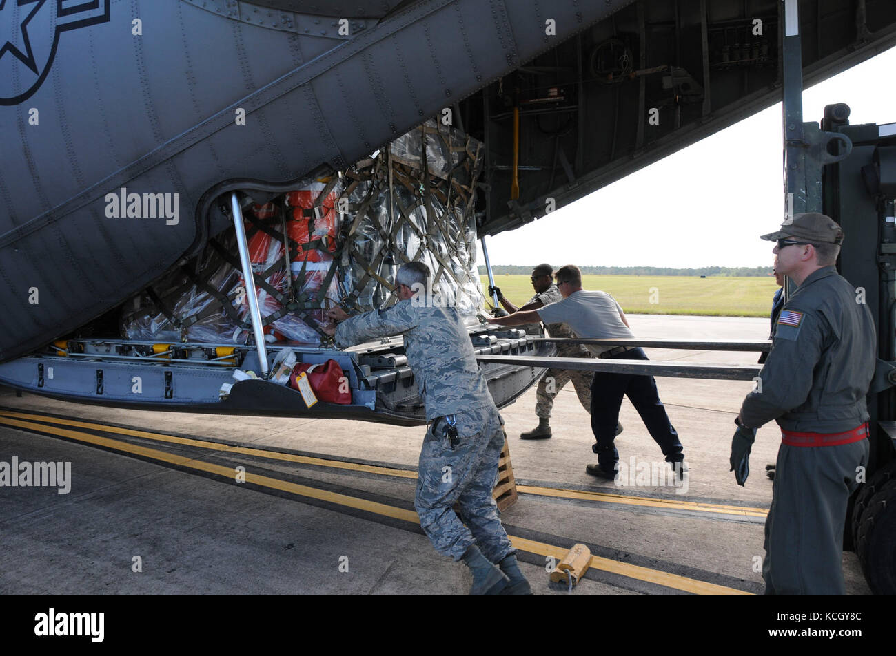 U.S. National Guard Soldiers from the South Carolina National Guard's 122nd and 178th Engineer Battalions depart McEntire Joint National Guard Base aboard a C-130 from 165th Airlift Wing, Savannah Georgia to provide Hurricane Maria relief support to Puerto Rico, Oct. 2, 2017. The 122nd is from Edgefield, S.C. and the 178th is based from Rock Hill, S.C. (U.S. Army photo by 1st Lt. Cody I. Denson) Stock Photo