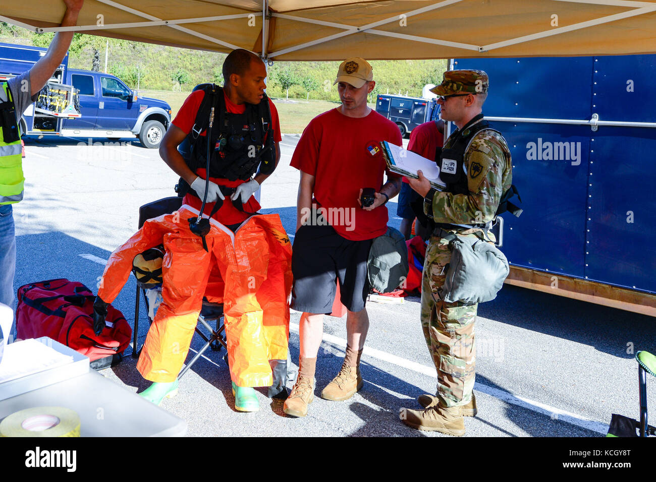 U.S. Soldiers and Airmen assigned to the 43rd Civil Support Team, South Carolina National Guard, don thier protective equipment during a training exercise on their techniques in assessing how to deal with a suspicious package, at the Columbia Metro Airport, West Columbia, S.C., Oct., 3, 2017. The training exercise was in preparation for an upcoming national level inspection as well as to hone their skills in advising, assisting, assessing and identify any hazards for federal, state and local incident commanders. (U.S. Air National Guard photo by Jorge Intriago) Stock Photo