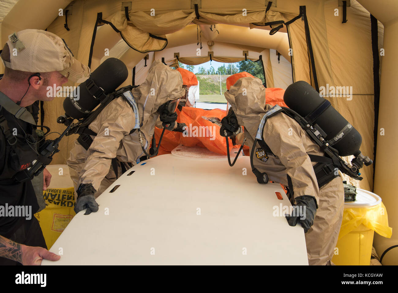 U.S. Soldiers and Airmen assigned to the 43rd Civil Support Team, South Carolina National Guard, set up their decontamination site and train on their techniques in assessing how to deal with a suspicious package, at the Columbia Metro Airport, West Columbia, S.C., Oct., 3, 2017. The training exercise was in preparation for an upcoming national level inspection as well as to hone their skills in advising, assisting, assessing and identify any hazards for federal, state and local incident commanders. (U.S. Army National Guard photo by Spc. Chelsea Baker) Stock Photo
