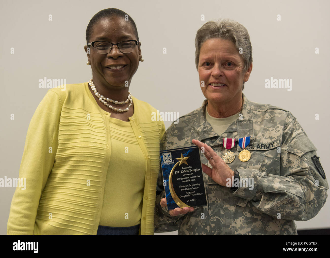 U.S. Army Sgt. 1st Class Kelsie Temples is honored on the day of her retirement at a ceremony held at the TAG complex in Columbia, South Carolina, October 3, 2017. Temples was a member of the Women's Army Corps (WAC) when she enlisted in 1976 and served 4 years active duty Army and 17 years South Carolina Army National Guard in multiple assignments, including Finance Non Commissioned Officer for the Joint Force Headquarters Fiscal Accounting Section as well as a Military Pay Clerk for the Headquarters State Area Command. (U.S. Army National Guard photo by Spc. Chelsea Baker) Stock Photo