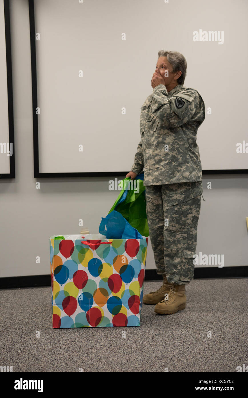 U.S. Army Sgt. 1st Class Kelsie Temples is honored on the day of her retirement at a ceremony held at the TAG complex in Columbia, South Carolina, October 3, 2017. Temples was a member of the Women's Army Corps (WAC) when she enlisted in 1976 and served 4 years active duty Army and 17 years South Carolina Army National Guard in multiple assignments, including Finance Non Commissioned Officer for the Joint Force Headquarters Fiscal Accounting Section as well as a Military Pay Clerk for the Headquarters State Area Command. (U.S. Army National Guard photo by Spc. Chelsea Baker) Stock Photo