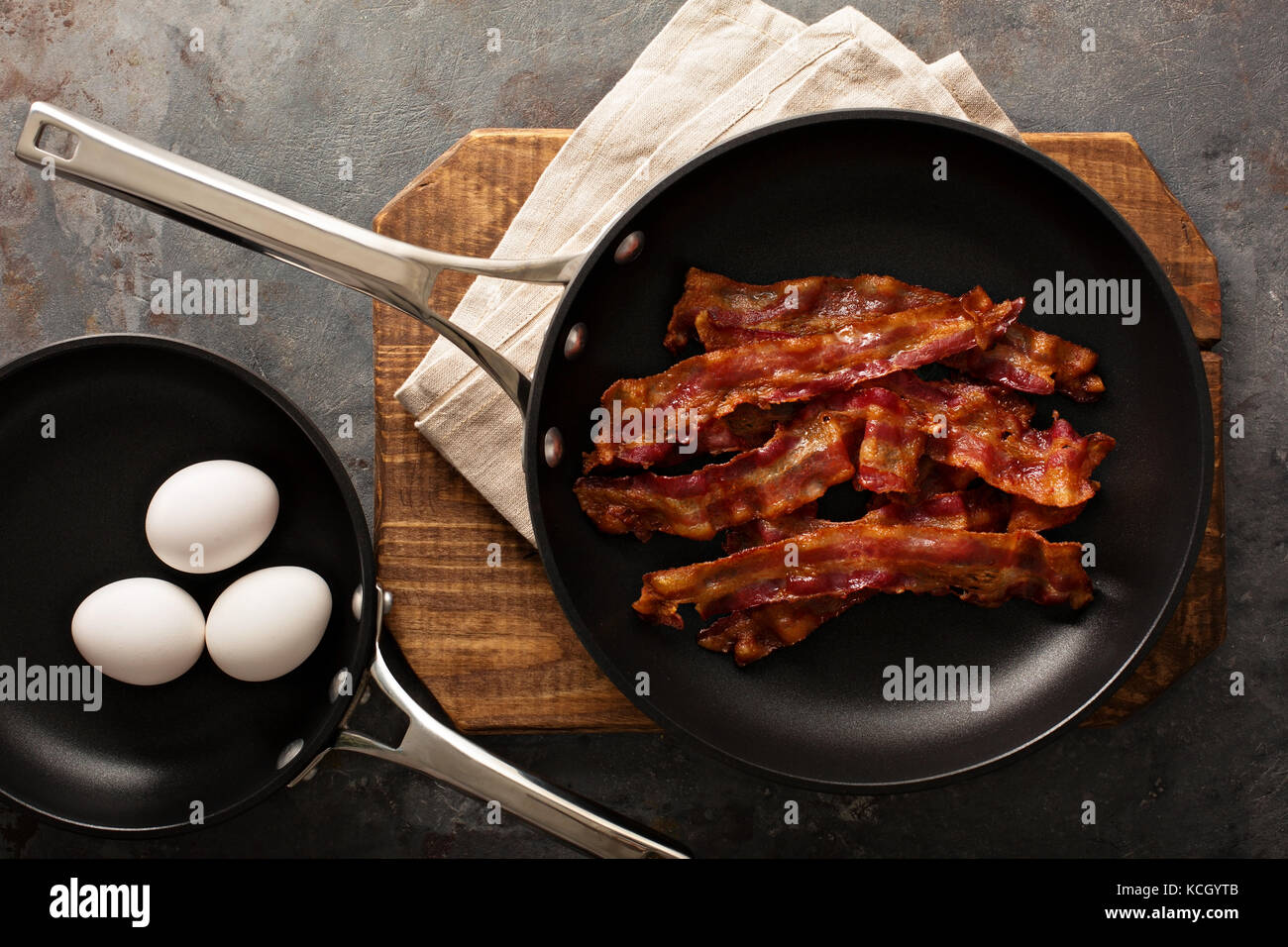 Cooked bacon on a skillet Stock Photo Alamy