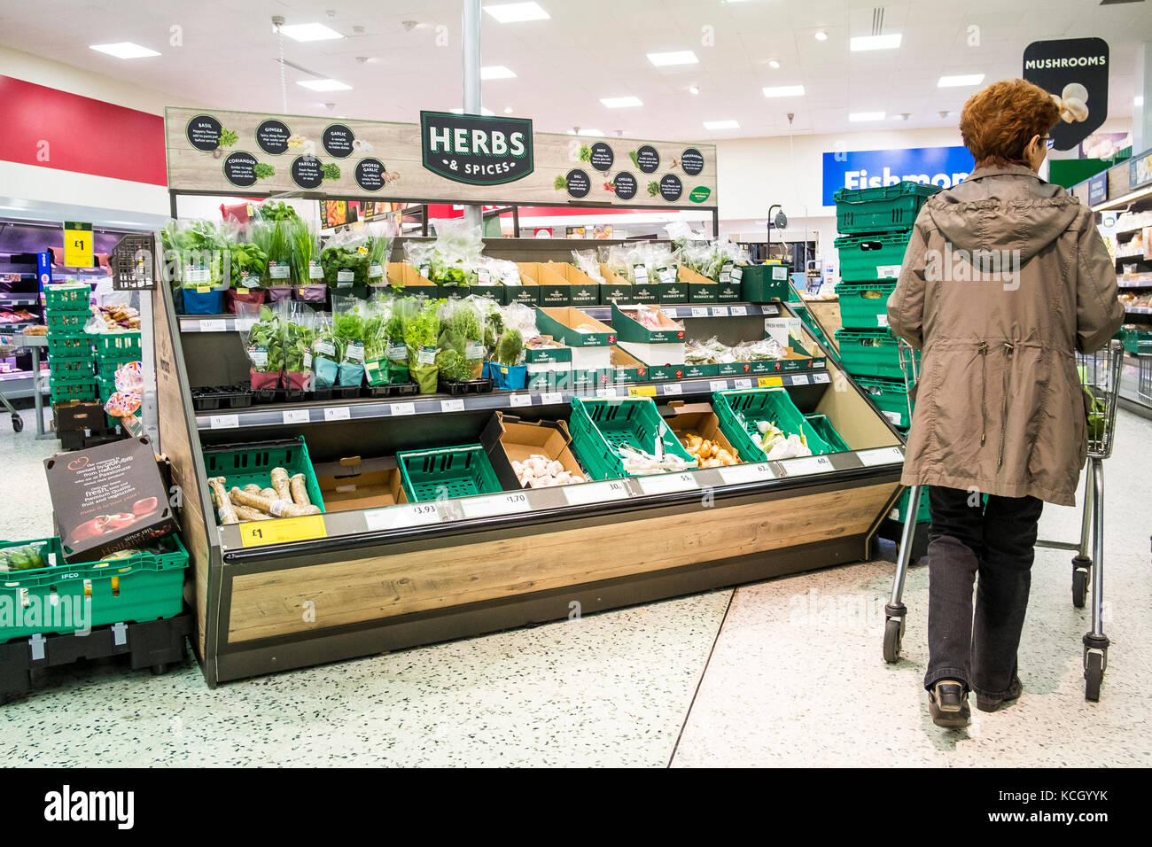 Shopping in a supermarket - a customer in a Morrisons Supermarket. Stock Photo